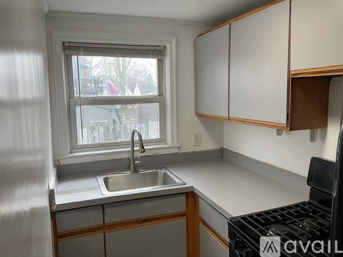 A kitchen with a sink and a window.