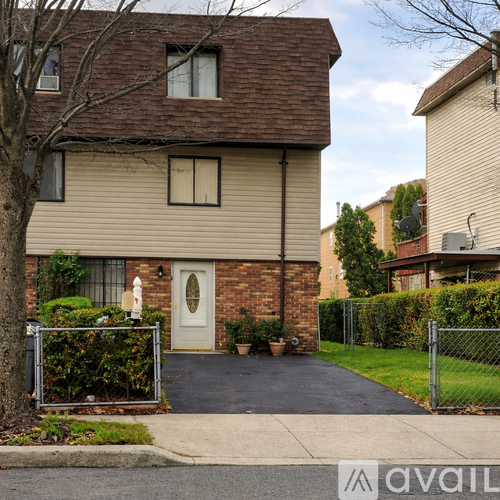 A house with a white door and a brick chimney.