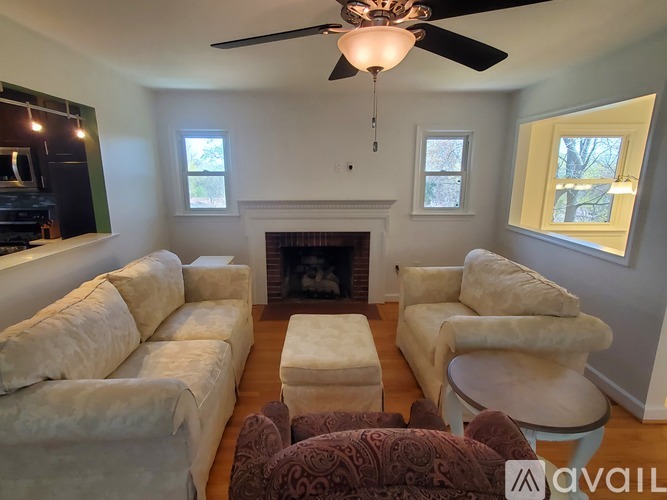 A living room with a fireplace and a couch.