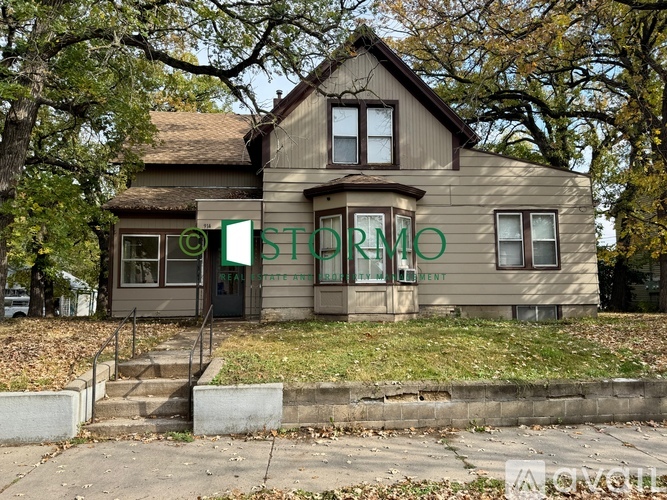 A house with a sign that says "STORM" on it.
