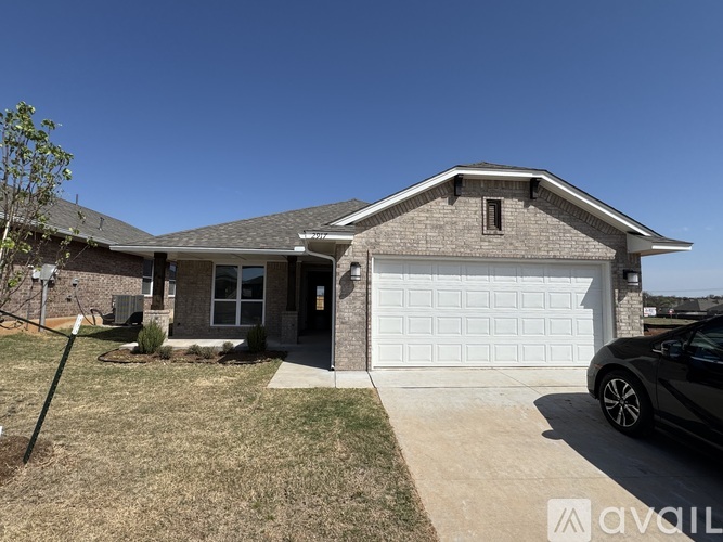 A house with a white garage door is for sale.