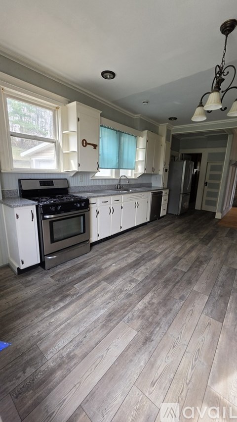 A kitchen with a stove and cabinets.