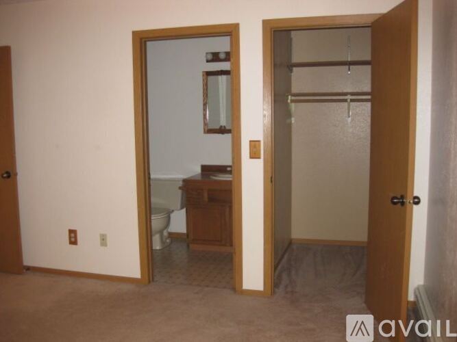A bathroom with a toilet and sink is shown.