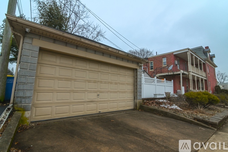 A detached house with a garage is for sale.
