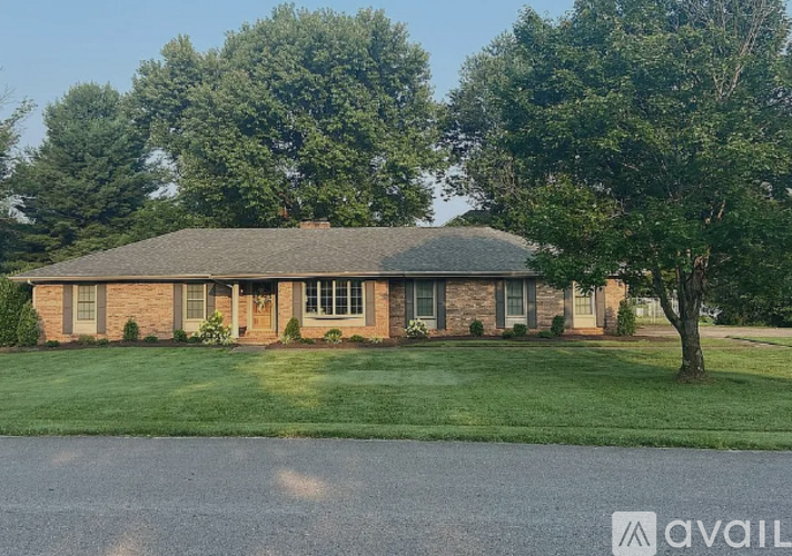 A house with a lawn in front of it.
