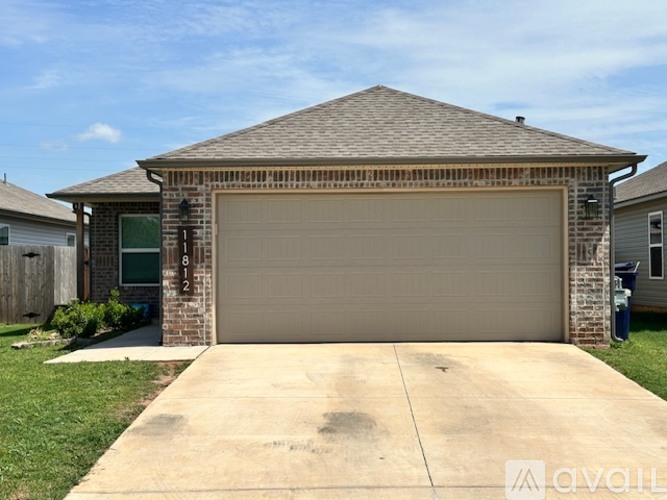 A house with a garage door that is number 812.