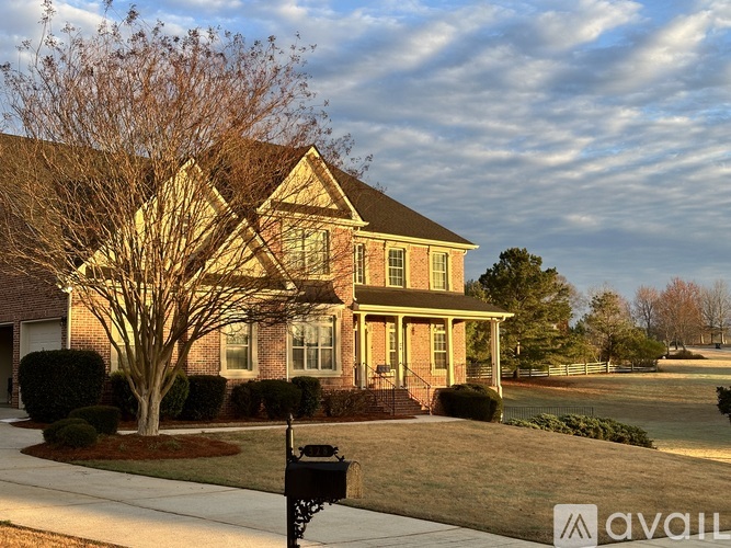A house with a tree in front of it.