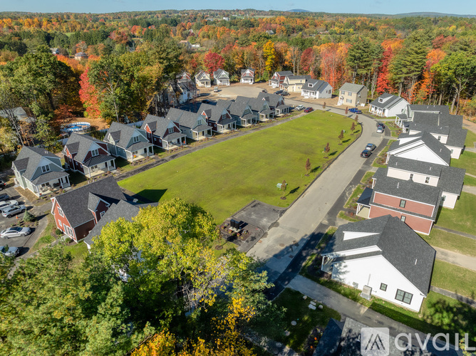 A bird's eye view of a residential neighborhood with houses and trees.