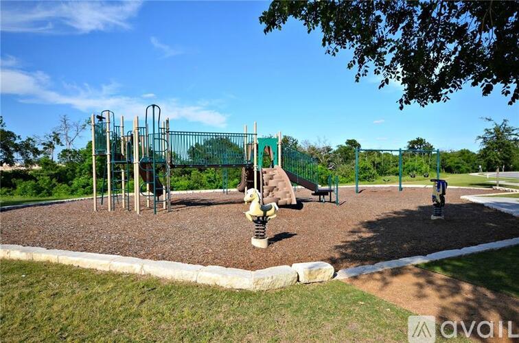 A playground with a swing set and a slide.