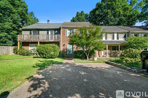 A house with a driveway in front of it.