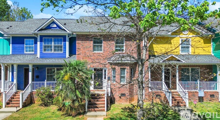 A row of houses with blue and yellow fronts.