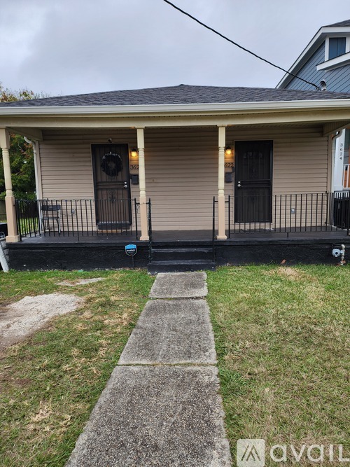 A house with a front porch and a wreath on the door.
