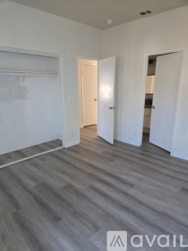 A room with a grey floor and white walls.