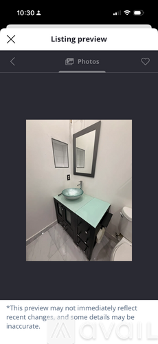 A bathroom with a sink and mirror.