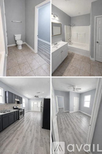 A bathroom with a toilet, sink, and bathtub.