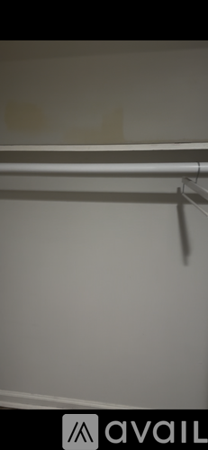 A white wall with a black logo that says "avail" on it.