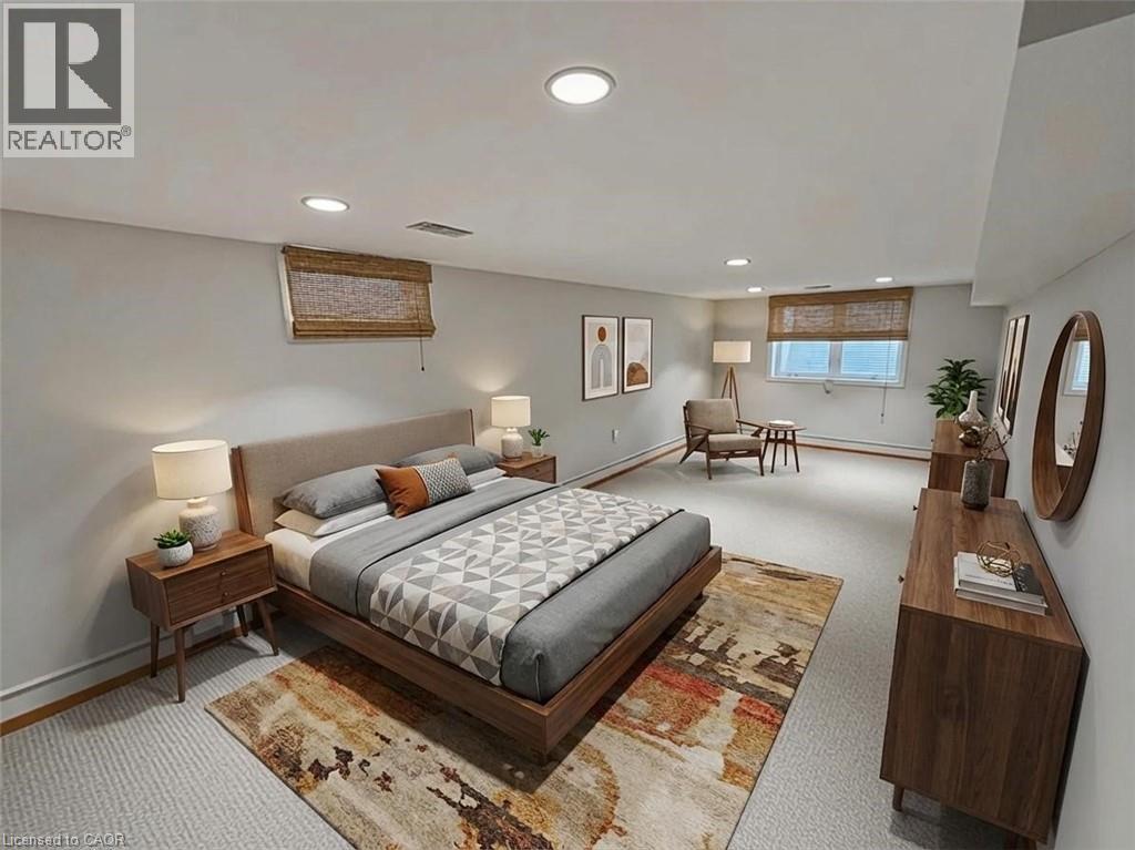 A bedroom with a large bed and a rug on the floor.