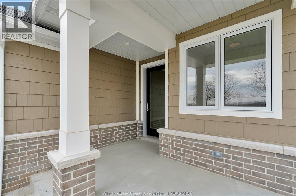 A house entrance with a glass door and a window.