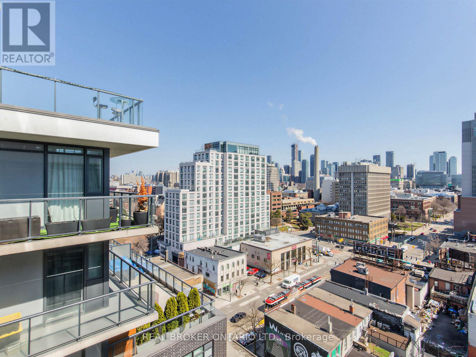 A cityscape with buildings and a clear sky.