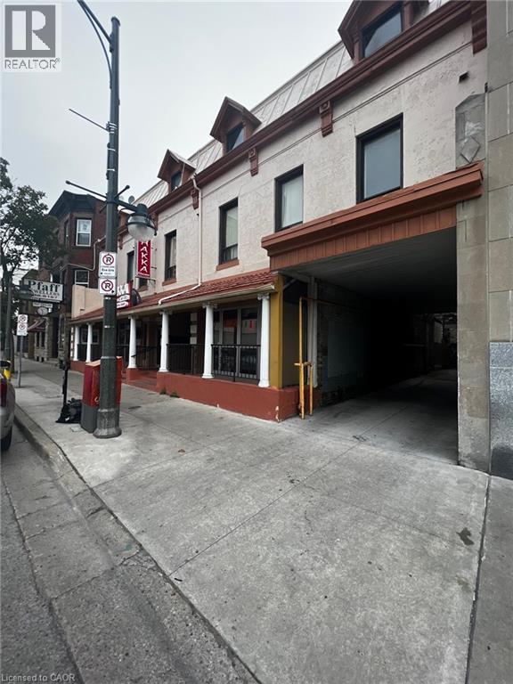 A street view of a building with a sign that says "REALTOR".
