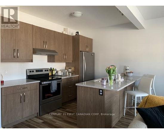 A kitchen with wooden cabinets and a black stove top oven.