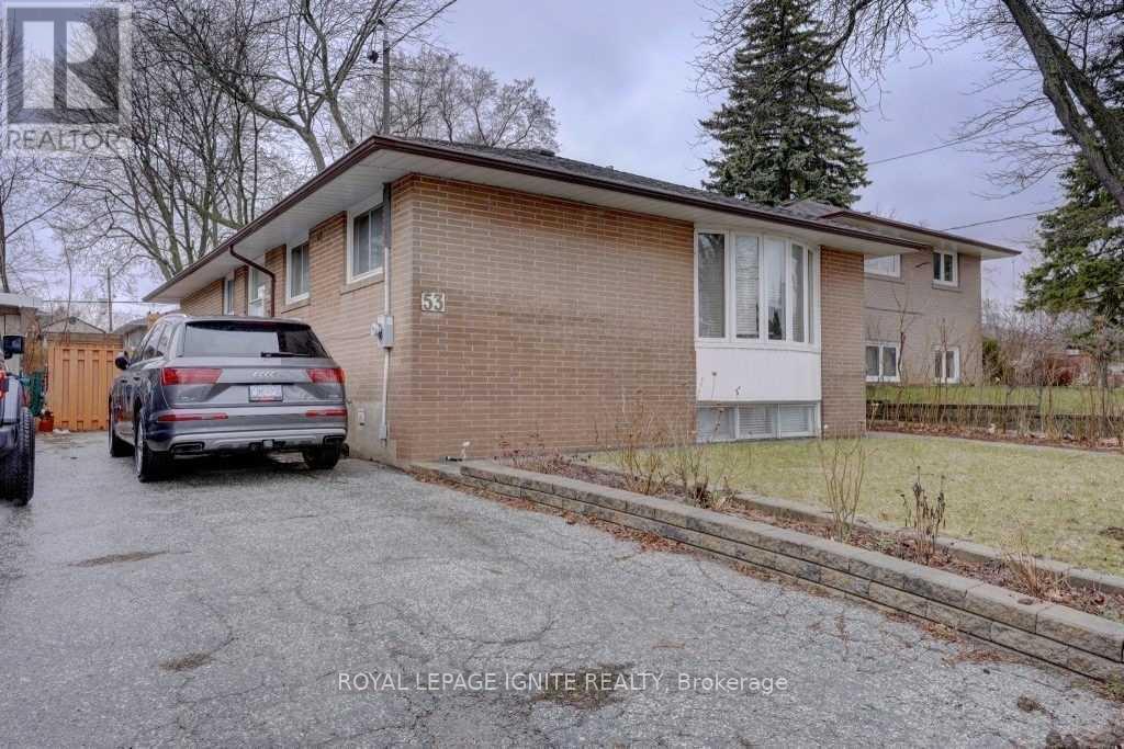 A house with the number 535 on it is for sale.