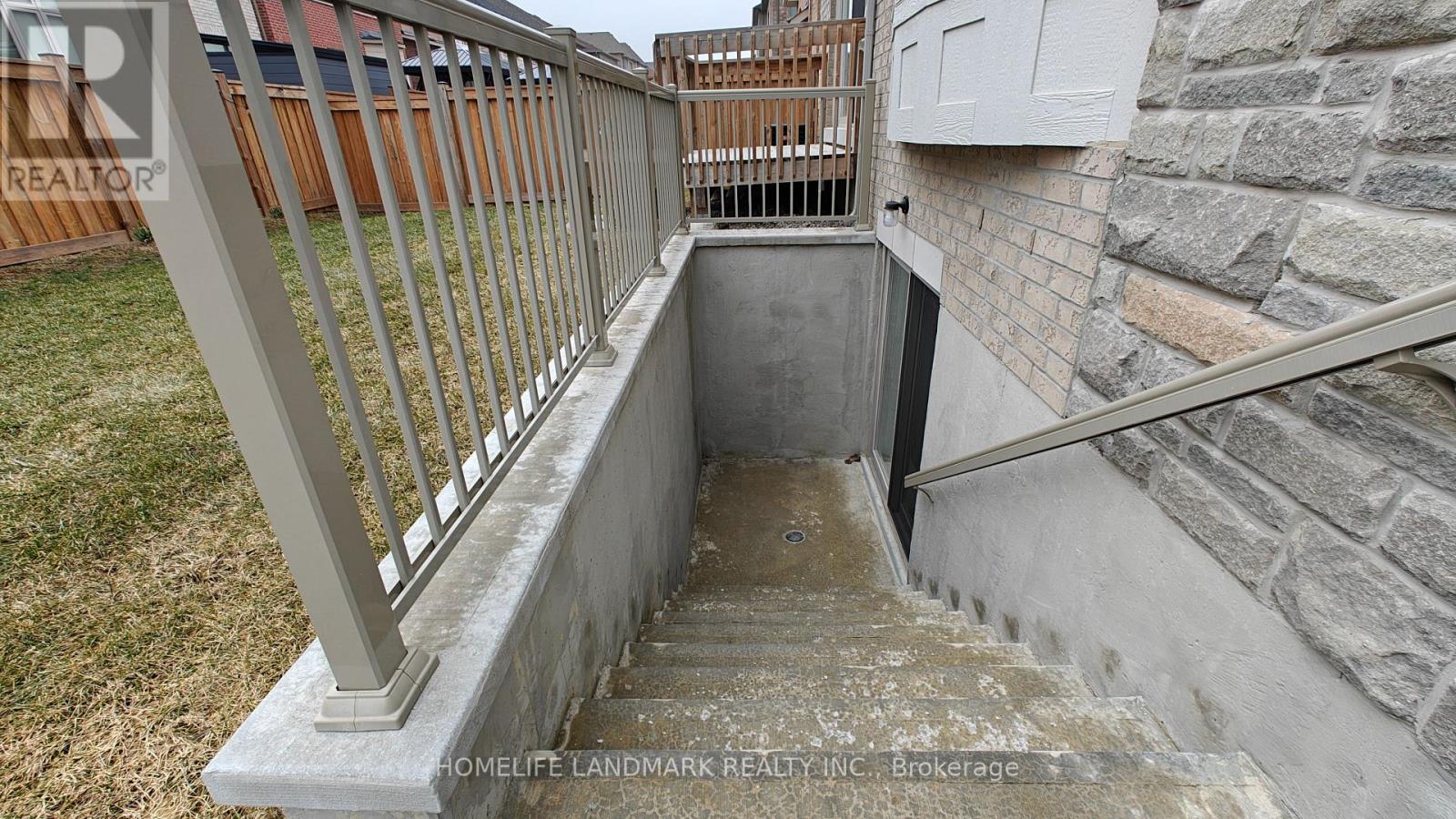 A concrete staircase with a metal railing.