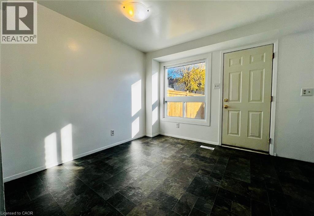 A room with a sliding door and a window.