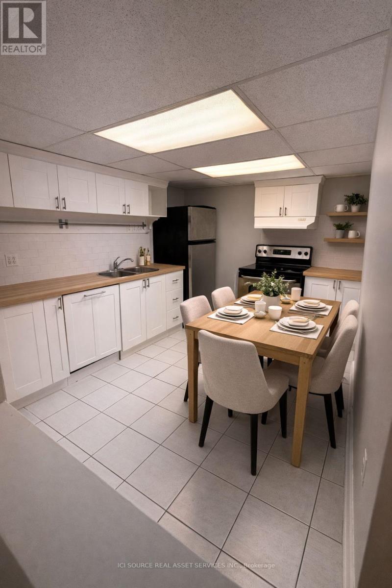 A well-lit kitchen with a dining table set for four.