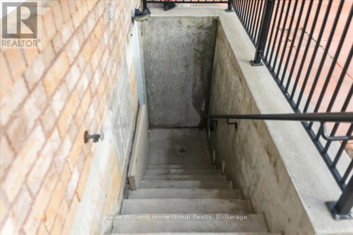 A stairway with a metal railing on the right side.