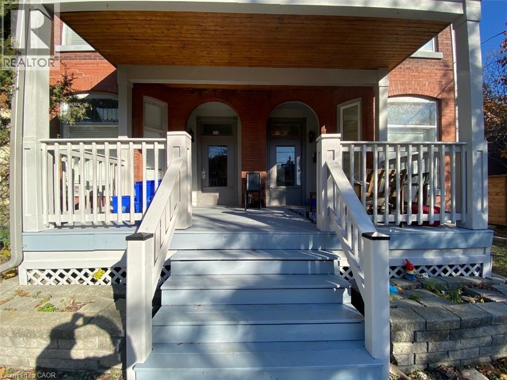 A porch with a table and chairs is shown.