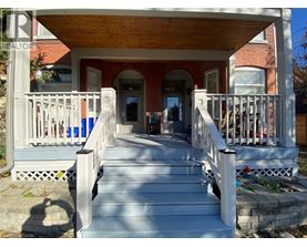 A porch with a table and chairs is shown.