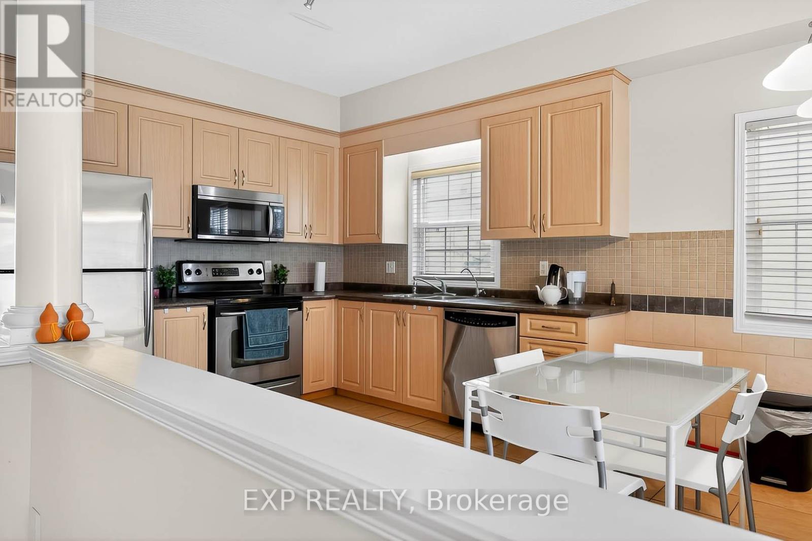 A kitchen with wooden cabinets and a white countertop.