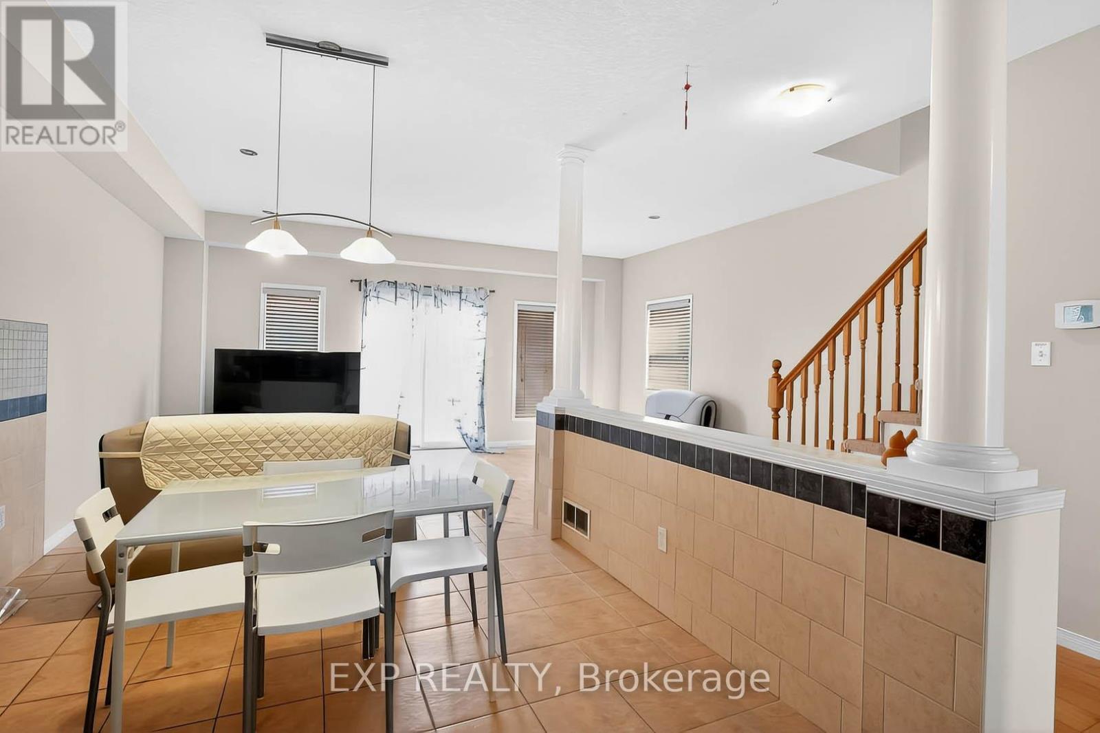 A dining room with a table and chairs is shown.