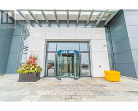 The entrance to a building with a glass door and a sign that reads "225-195".