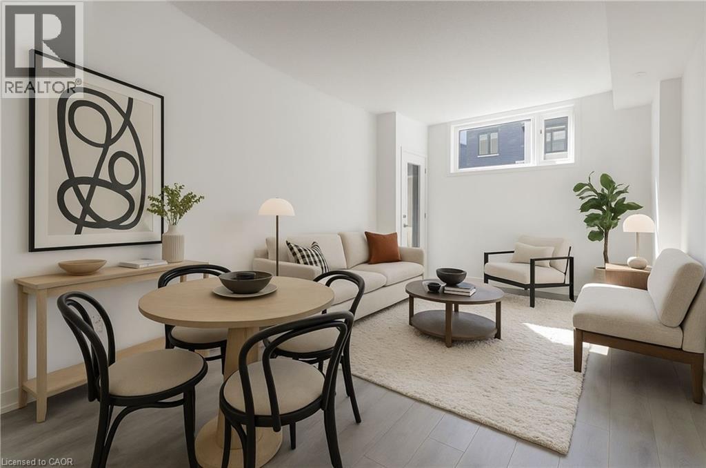A modern dining room with a round table and chairs.