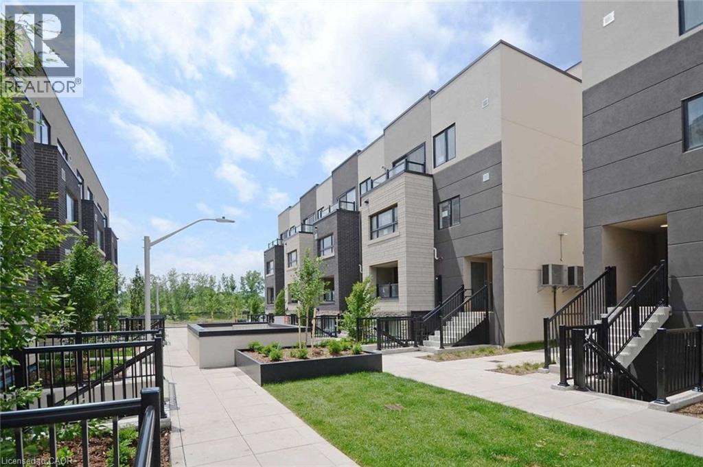 A modern apartment complex with a landscaped courtyard.