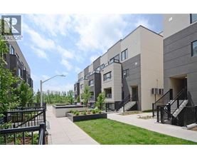 A modern apartment complex with a landscaped courtyard.