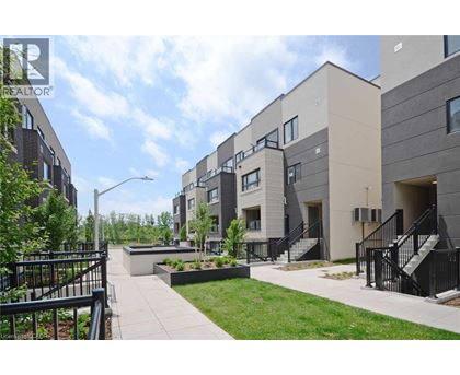 A modern apartment complex with a landscaped courtyard.