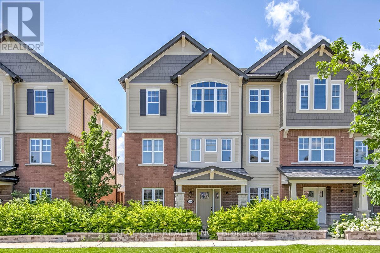 A row of houses with a realtor logo in the corner.