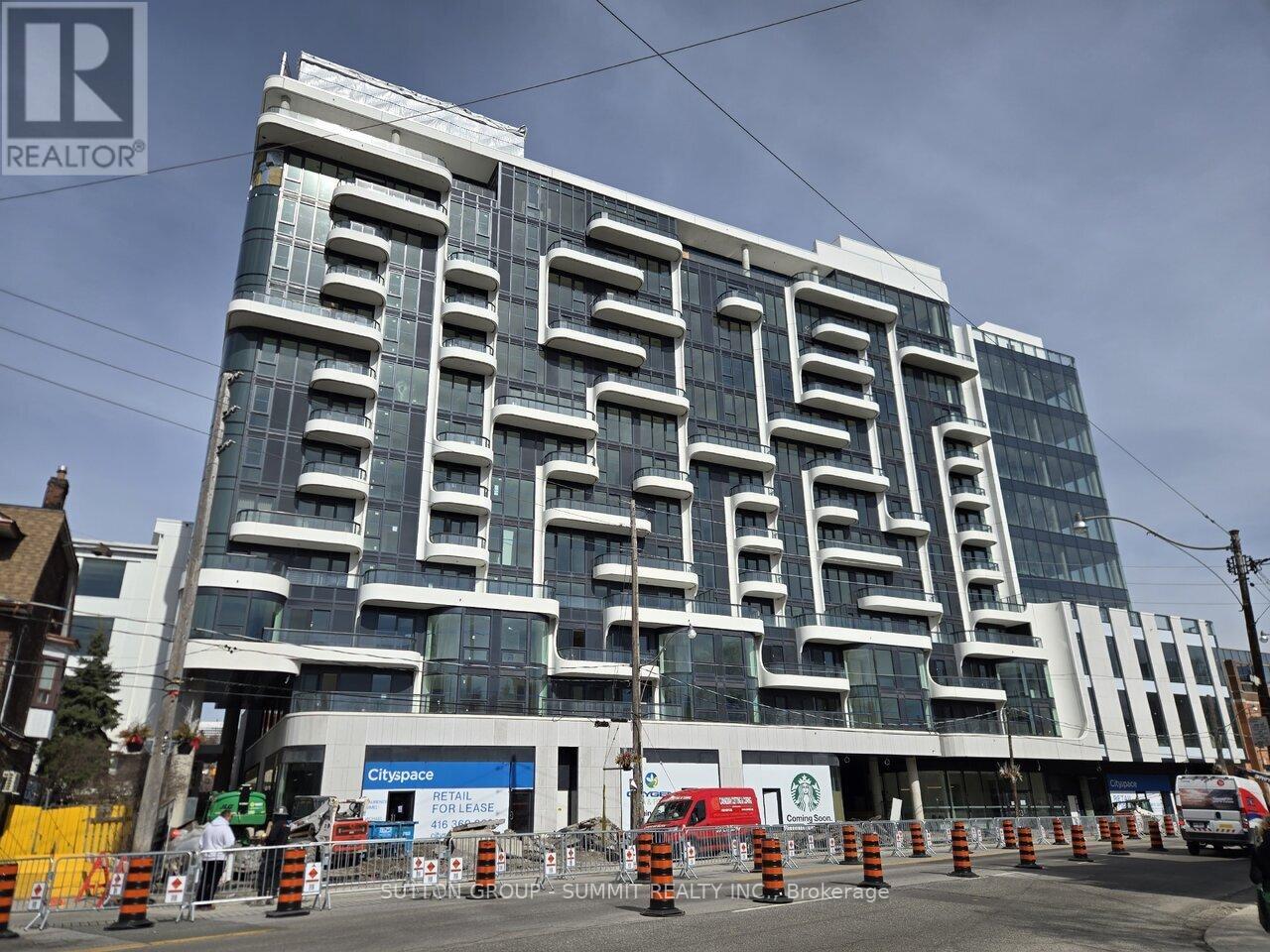 A large building with a glass facade is under construction with a sign that says "Cityplace for lease".
