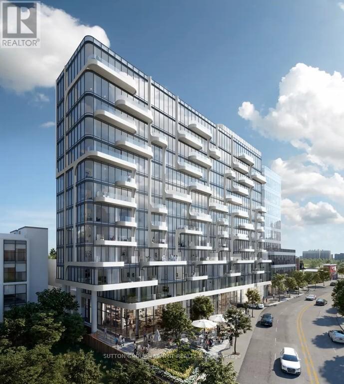 A modern multi-story building with a glass facade is depicted in the image.