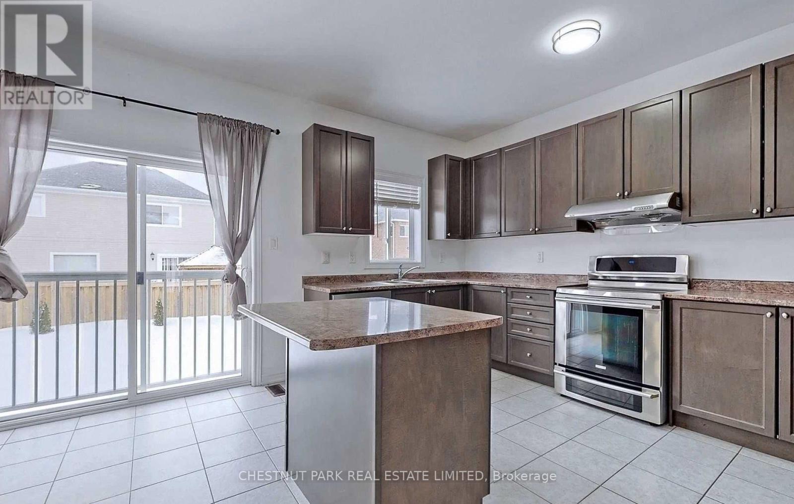 A kitchen with a stove top oven and a microwave.