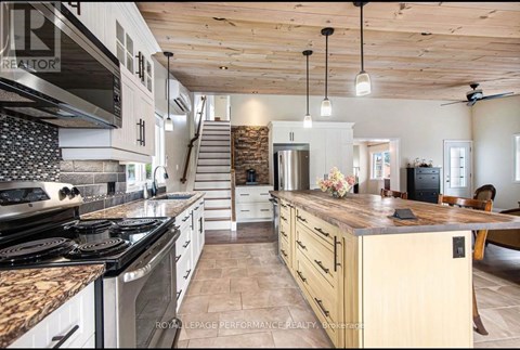 A kitchen with a stove top oven and a counter top.