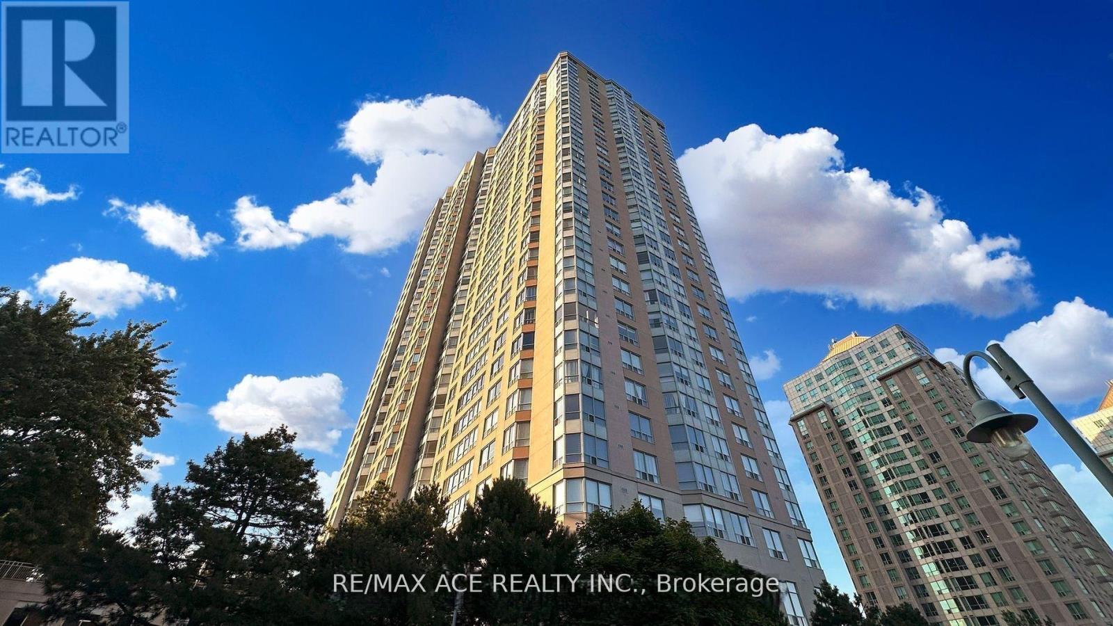 A tall building with the RE/MAX ACE REALTY INC. logo on it.