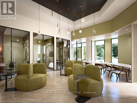 A living room with a green sofa and a wooden table.