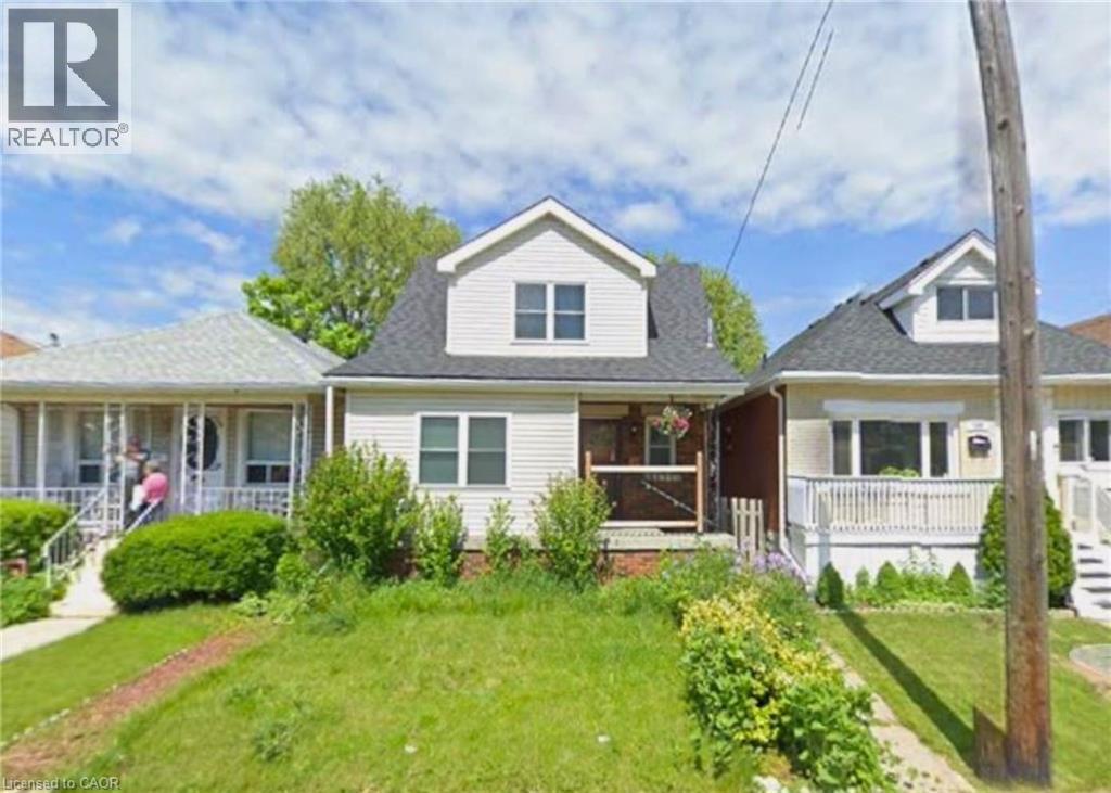 A house with a lawn in front of it.