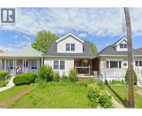 A house with a lawn in front of it.