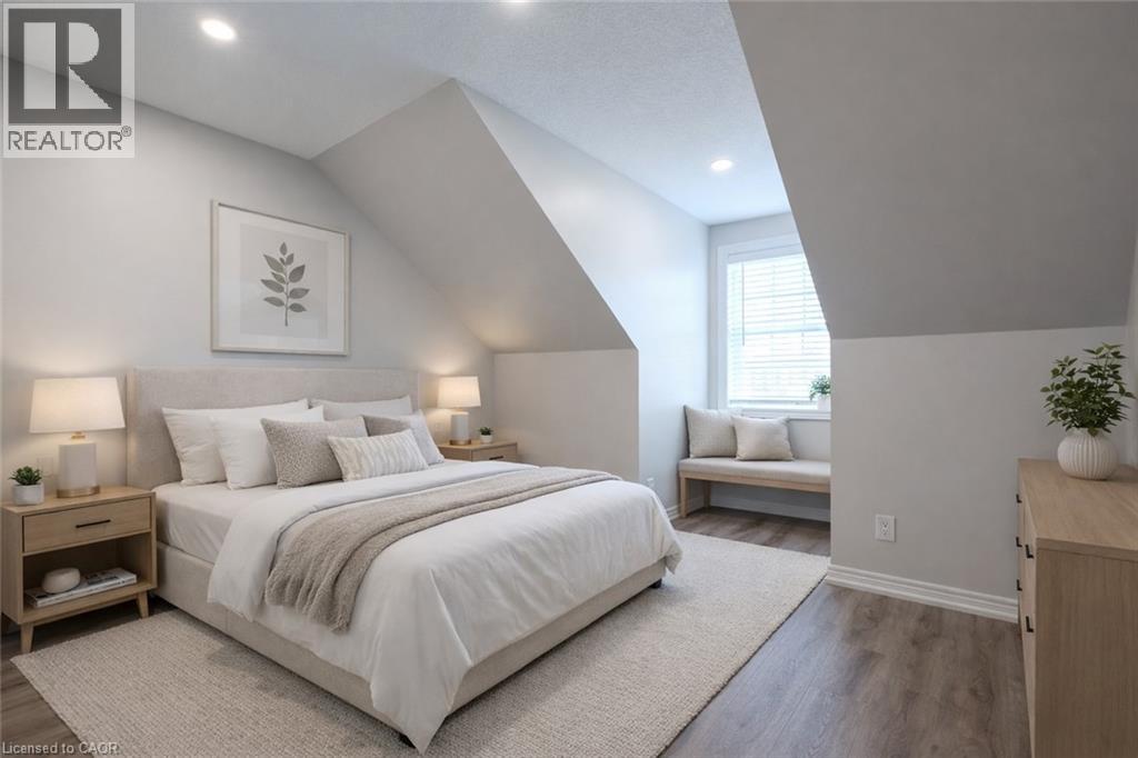 A bedroom with a large bed and a window.