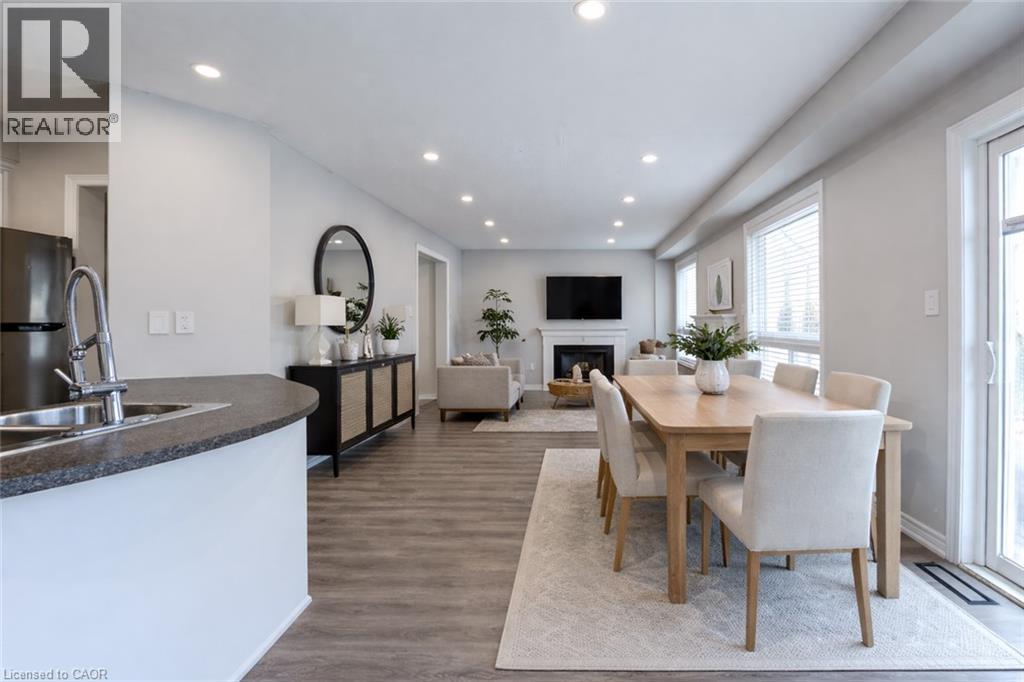 A modern kitchen with a dining table and chairs.